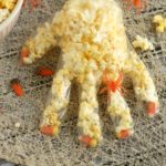 This two-ingredient Halloween treat is perfect for class parties or trick-or-treating! #Halloween | Halloween Snack | Halloween treat | popcorn hand | snack hand | glove snack | Halloween recipe | Halloween snack ideas | Halloween treat ideas | Halloween food | Halloween food ideas for parties | Halloween treats | Halloween treats for school | Halloween snacks for school | Halloween treats for school party