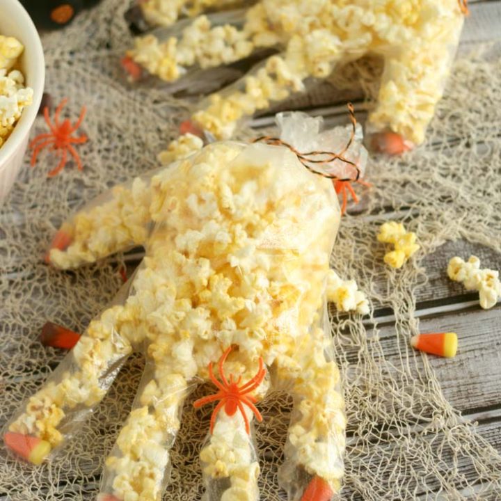 This two-ingredient Halloween treat is perfect for class parties or trick-or-treating! #Halloween | Halloween Snack | Halloween treat | popcorn hand | snack hand | glove snack | Halloween recipe | Halloween snack ideas | Halloween treat ideas | Halloween food | Halloween food ideas for parties | Halloween treats | Halloween treats for school | Halloween snacks for school | Halloween treats for school party