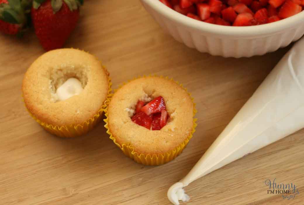 These delicious gluten free strawberries and cream filled cupcakes will be the perfect addition to any Spring or Summer gather, especially a Mother's Day dessert! gluten free cupcakes | gluten free strawberry cupcakes | gluten free filled cupcakes | Spring gluten free cupcakes | Summer gluten free cupcakes | gluten free mothers day dessert #glutenfree