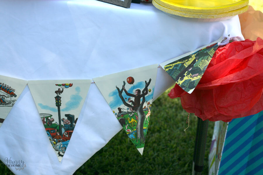 Learn how to make a banner out of book pages for your next birthday party from hunnyimhomediy.com | book page banner | Curious George birthday party | Curious George party | Curious George party decorations | Curious George party ideas | Curious George decor | book page decor | book page decorations | book page crafts | book page craft ideas