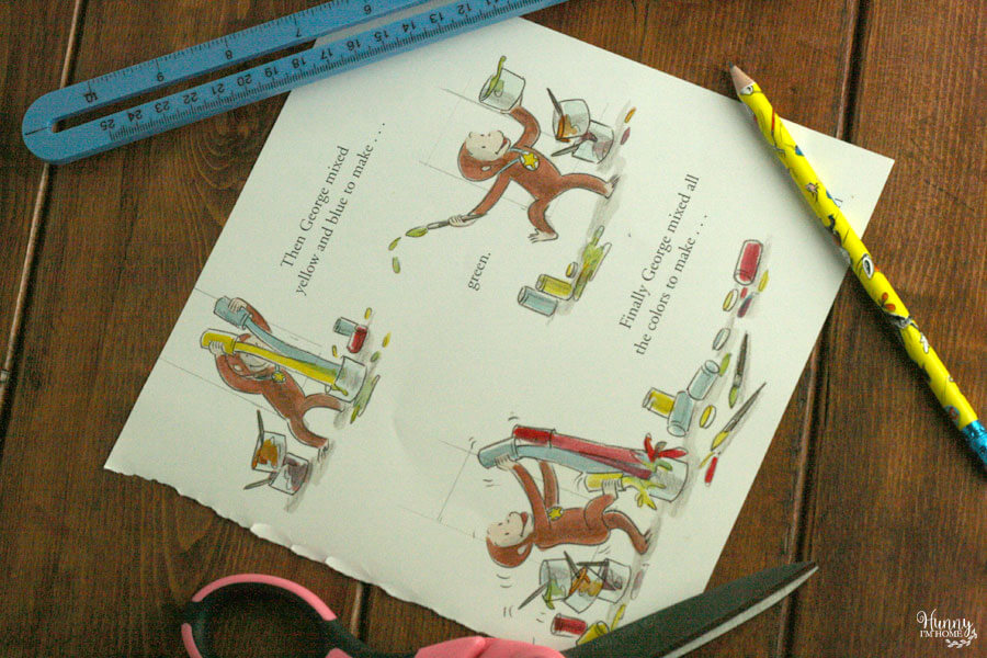 Learn how to make an adorable bunting cake topper out of book pages and washi tape from hunnyimhomediy.com | DIY bunting cake topper | bunting cake topper DIY | bunting cake topper baby | book page cake topper | book page crafts | flag cake topper DIY | book cake topper | DIY birthday cake topper | Curious George cake topper