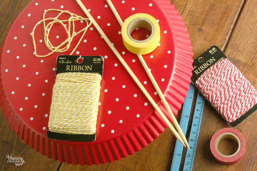 Learn how to make an adorable bunting cake topper out of book pages and washi tape from hunnyimhomediy.com | DIY bunting cake topper | bunting cake topper DIY | bunting cake topper baby | book page cake topper | book page crafts | flag cake topper DIY | book cake topper | DIY birthday cake topper | Curious George cake topper