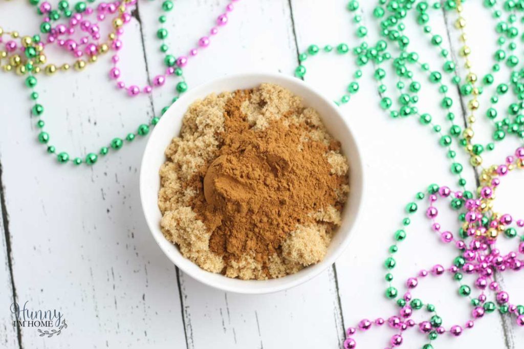 You'll love this easy gluten free king cake recipe! This turns a king cake recipe traditional into adorable gluten free king cake bundt cakes and makes king cake gluten free. These gluten free mini king cakes are the perfect way to celebrate Mardis Gras! #mardigras #glutenfree