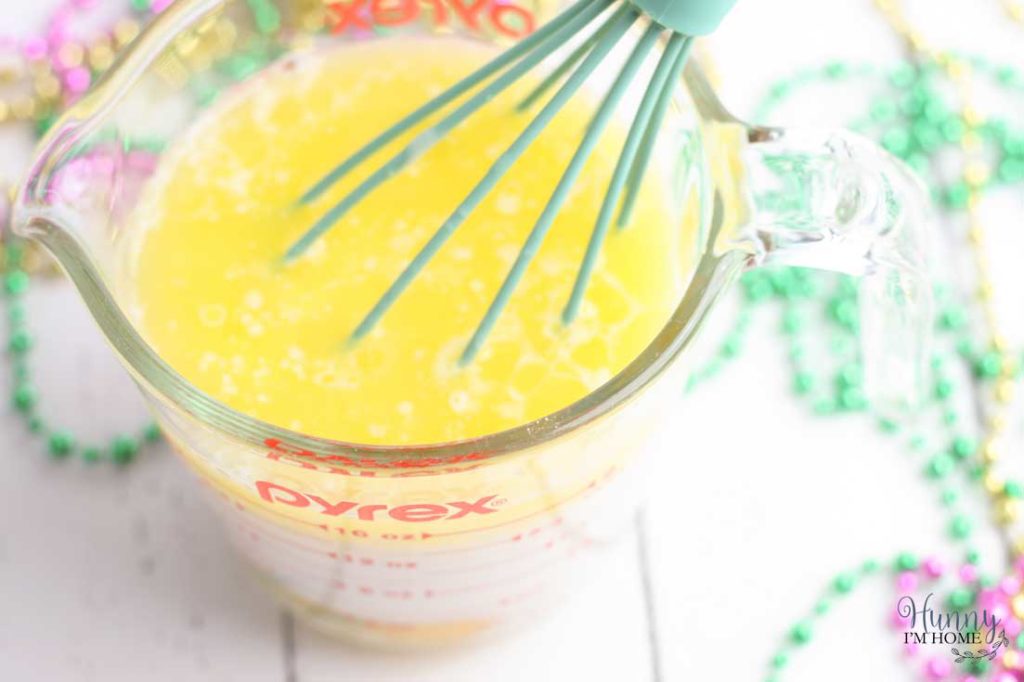 You'll love this easy gluten free king cake recipe! This turns a king cake recipe traditional into adorable gluten free king cake bundt cakes and makes king cake gluten free. These gluten free mini king cakes are the perfect way to celebrate Mardis Gras! #mardigras #glutenfree