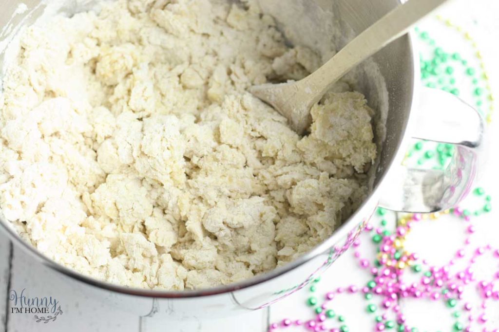 You'll love this easy gluten free king cake recipe! This turns a king cake recipe traditional into adorable gluten free king cake bundt cakes and makes king cake gluten free. These gluten free mini king cakes are the perfect way to celebrate Mardis Gras! #mardigras #glutenfree