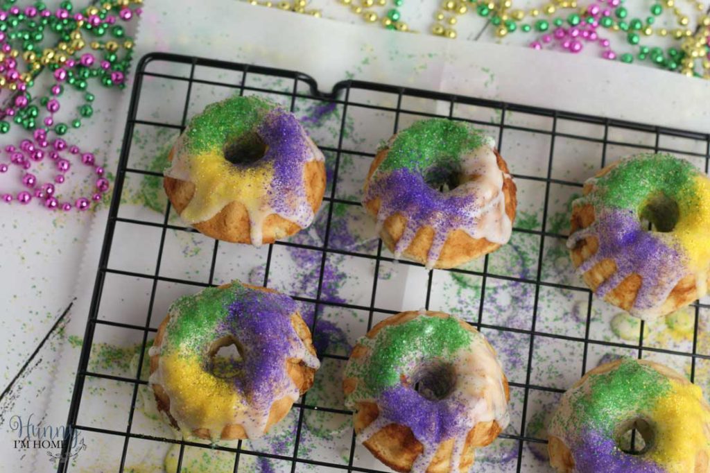 You'll love this easy gluten free king cake recipe! This turns a king cake recipe traditional into adorable gluten free king cake bundt cakes and makes king cake gluten free. These gluten free mini king cakes are the perfect way to celebrate Mardis Gras! #mardigras #glutenfree