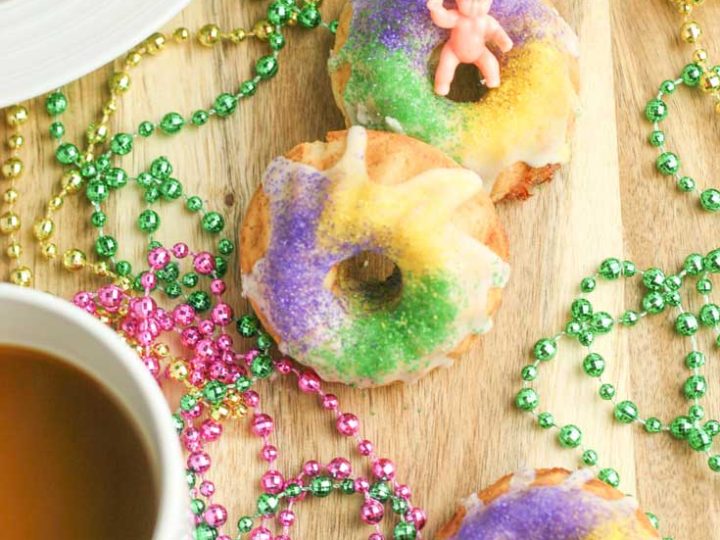 You'll love this easy gluten free king cake recipe! This turns a king cake recipe traditional into adorable gluten free king cake bundt cakes and makes king cake gluten free. These gluten free mini king cakes are the perfect way to celebrate Mardi Gras! #mardigras #glutenfree