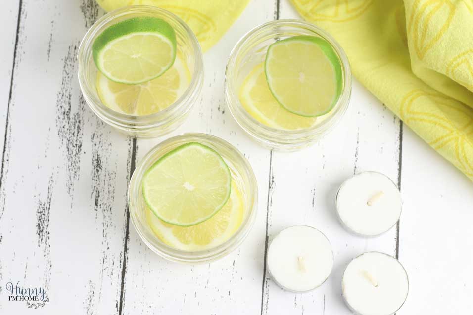 Lemons and limes in DIY mosquito repellent candle