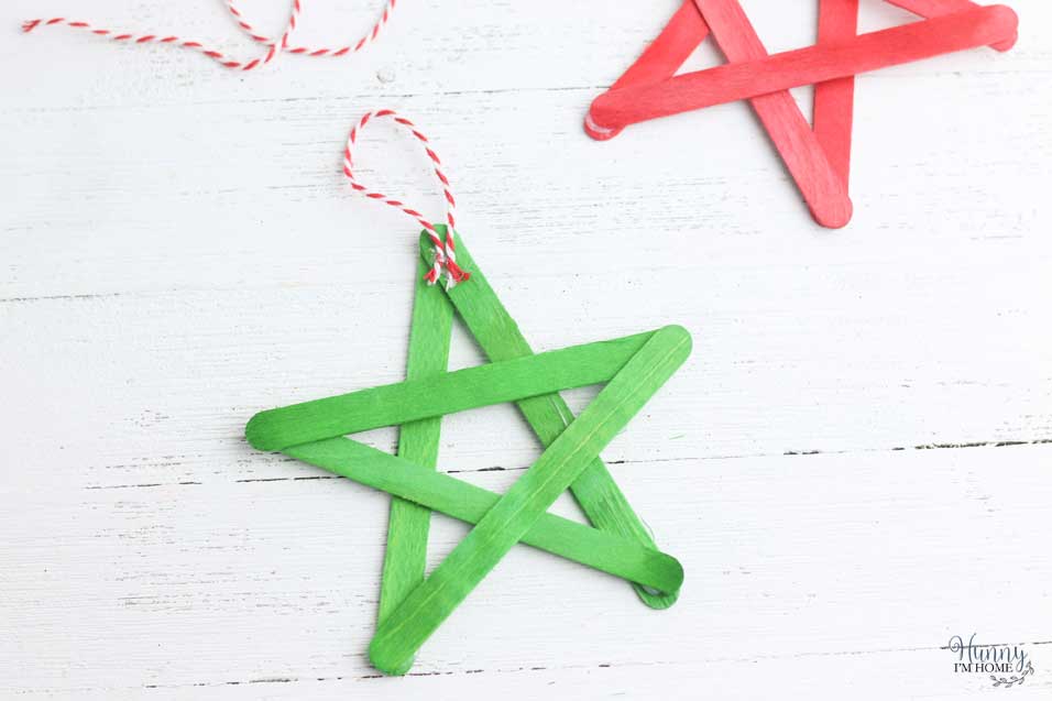 Add string to popsicle stick Christmas ornament