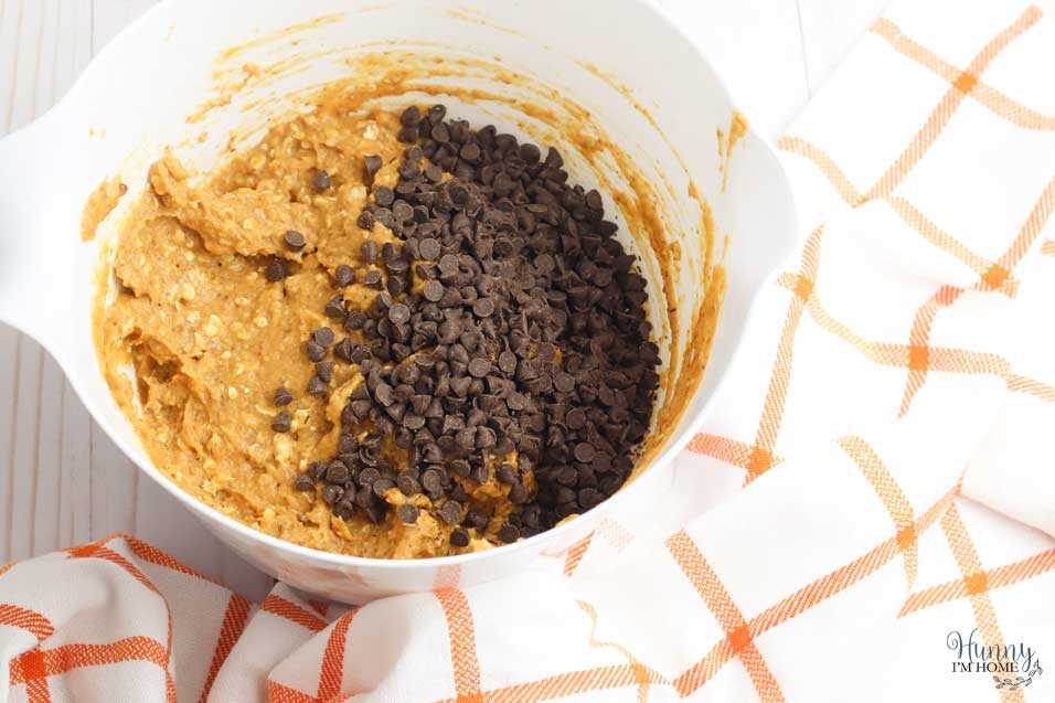 Add chocolate chips to gluten free pumpkin muffins