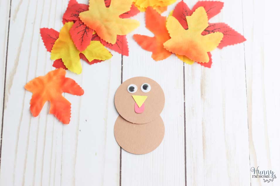 Add eyes to turkey craft for kids