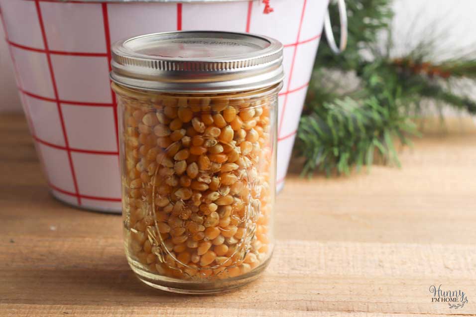 Fill jar with popcorn kernels
