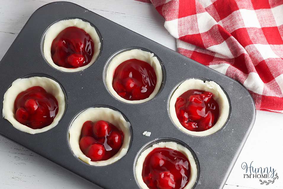 Fill each cup with cherry pie filling