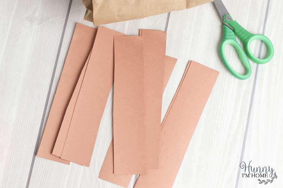 Cut strips of paper to make the arms and legs