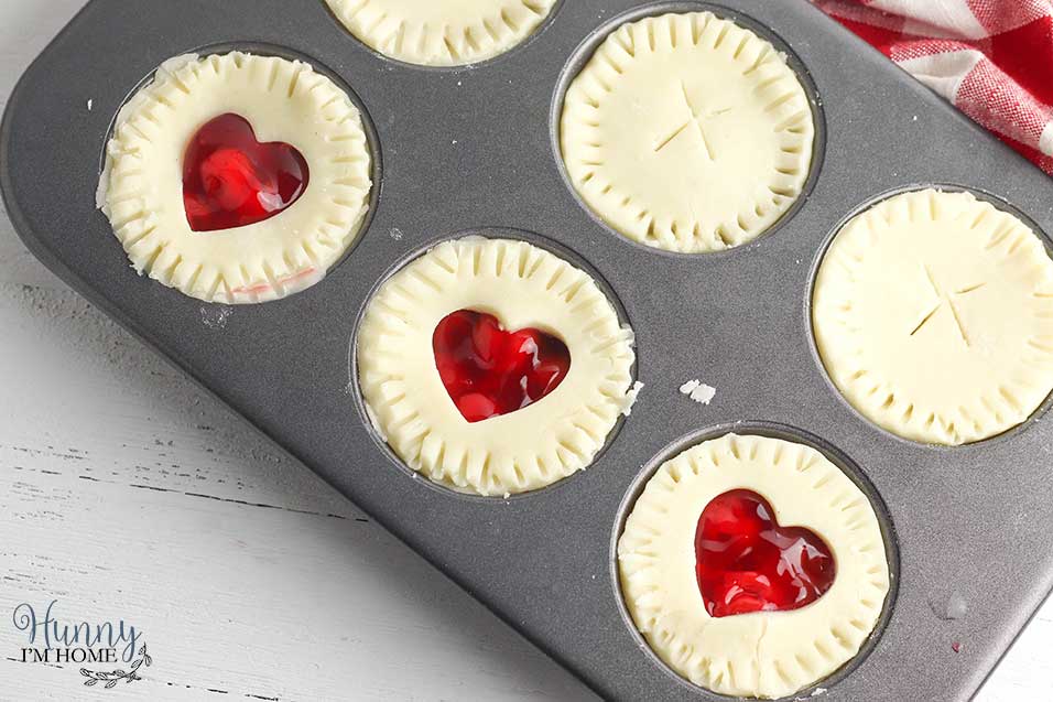 Add top crust to gluten free cherry pie