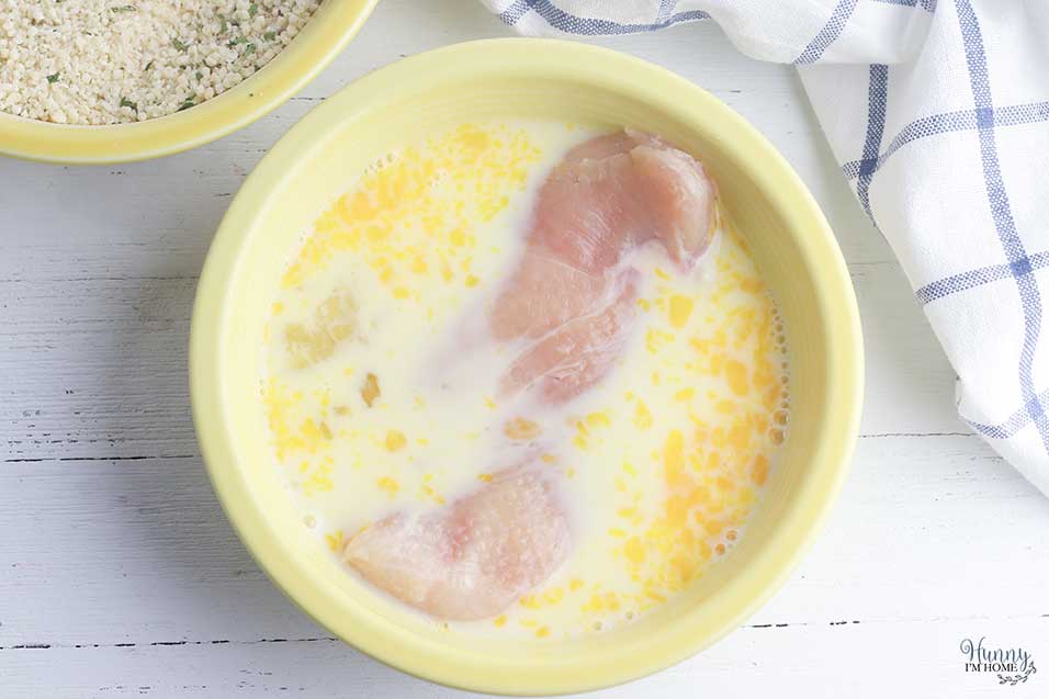 Dip chicken in eggs for gluten free chicken parmesan baked