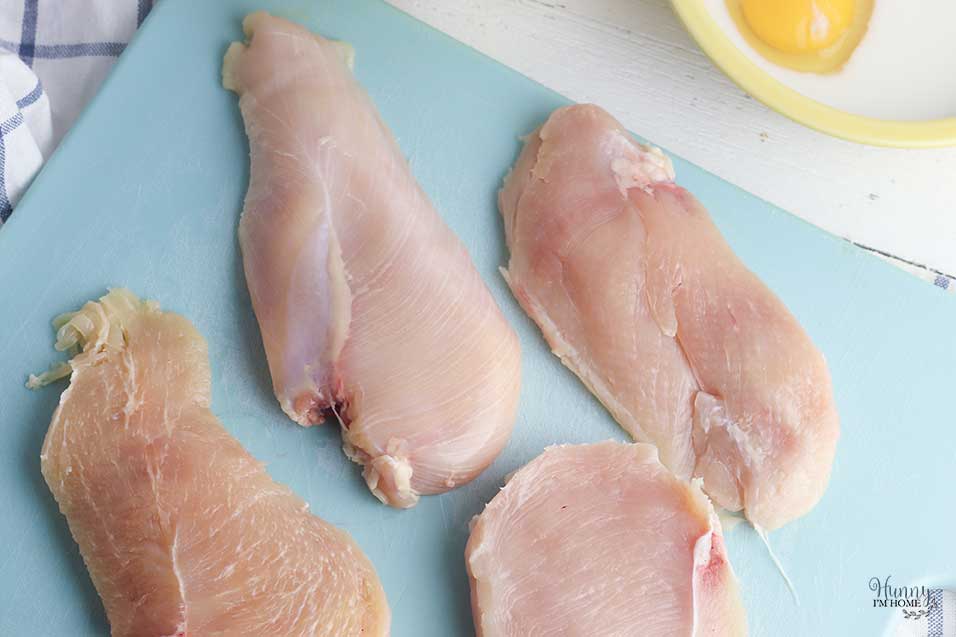 Cut chicken in half to make cutlets