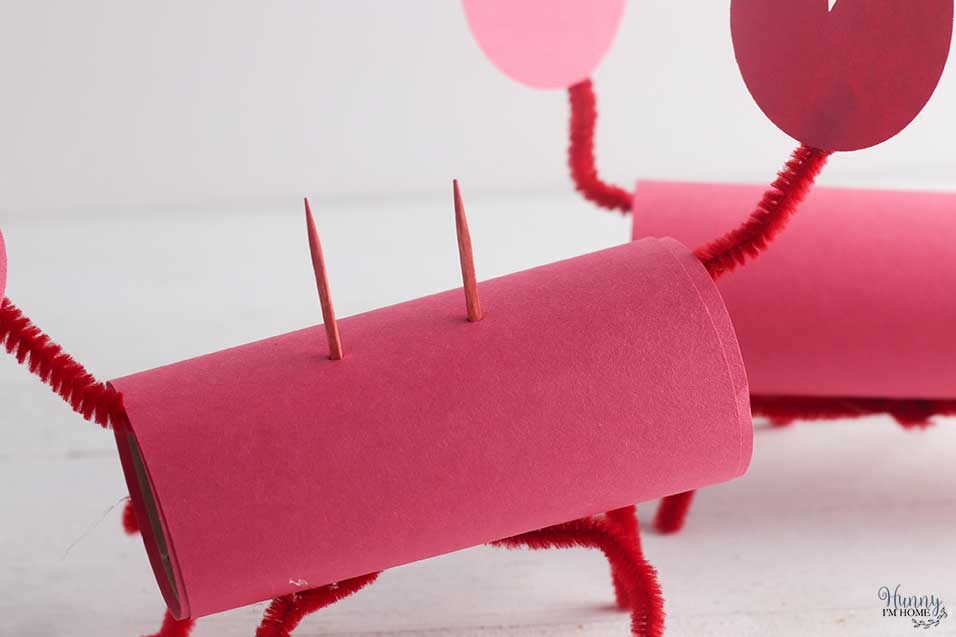 Stick the toothpicks into the toilet paper tube craft