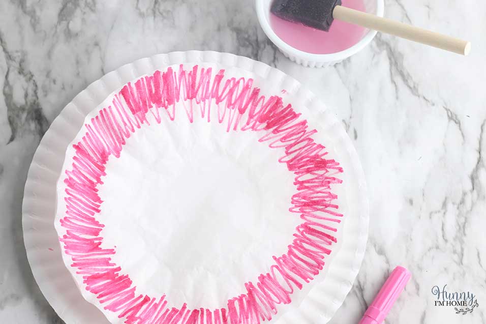 Color the outer edge of the coffee filter