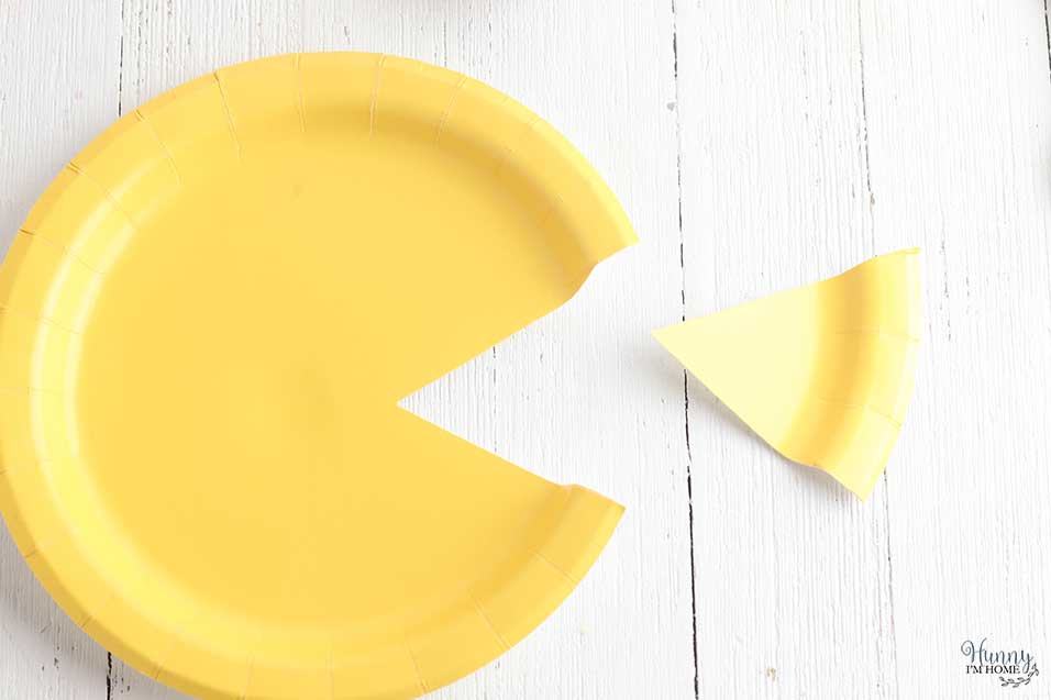 Cut out mouth from paper plate fish