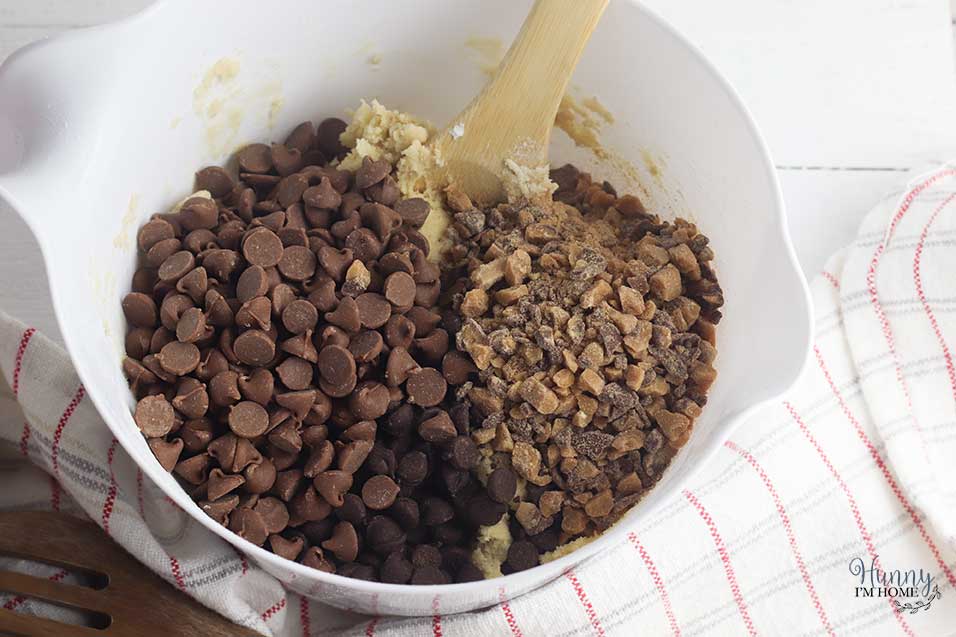 Add chocolate chips and toffee chips to gluten free cookie dough