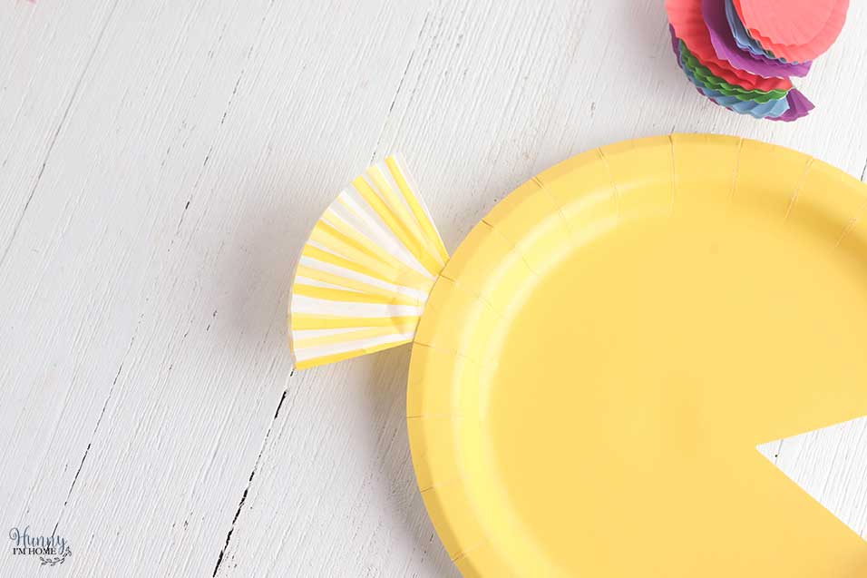 Cupcake wrapper tail on fish from paper plate