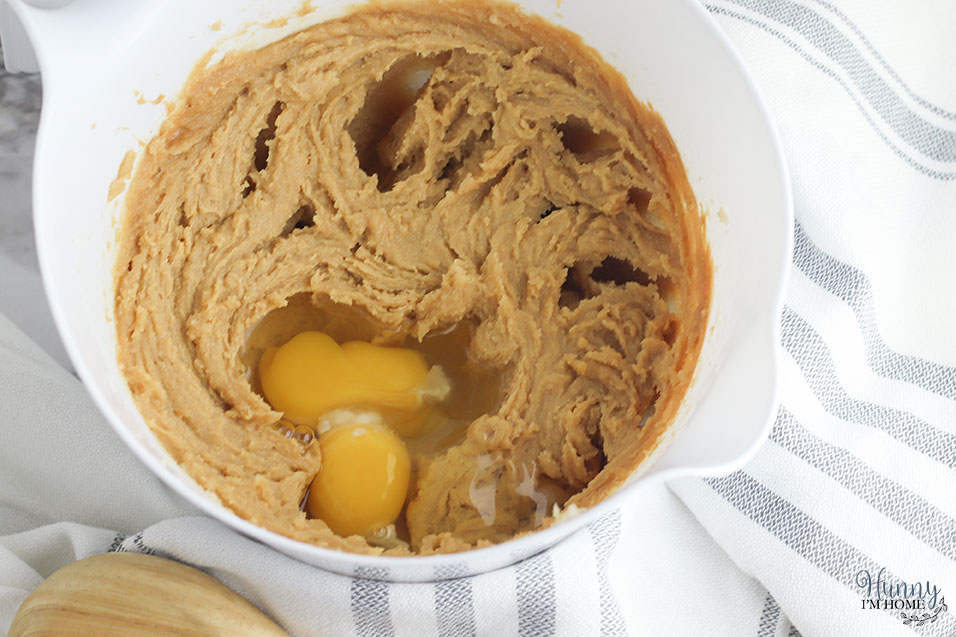 Add the eggs to the oatmeal cookie dough