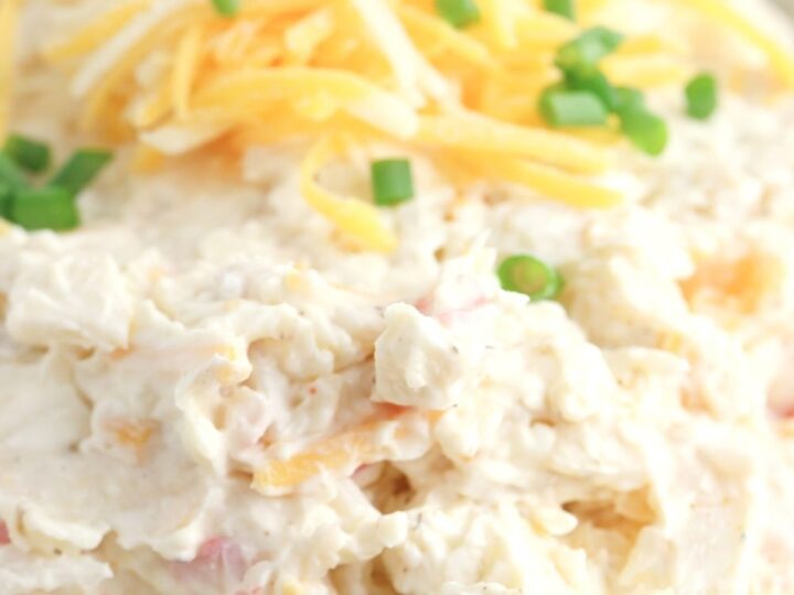 cold crab dip topped with shredded cheese and chives