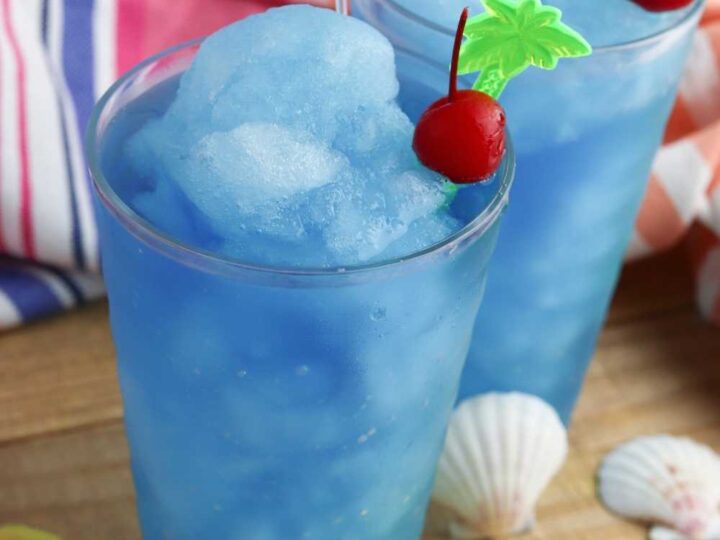 two ocean water slushes with cherries and drink umbrellas